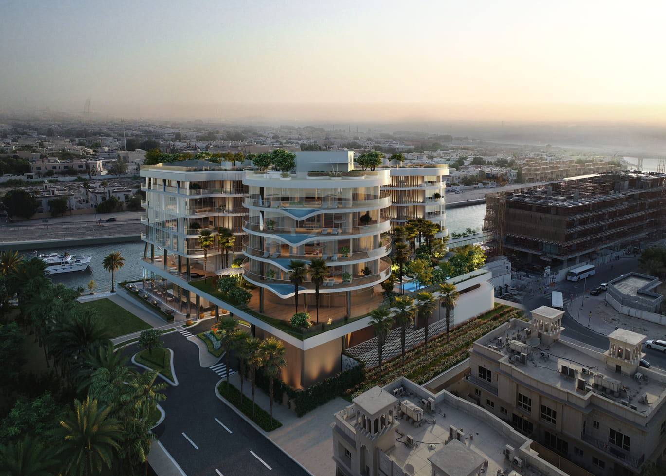 Aerial view of Dubai’s iconic waterfront skyline featuring modern high-rise villas and yachts, representing exclusive Luxury Real Estate investment opportunities in the UAE.
