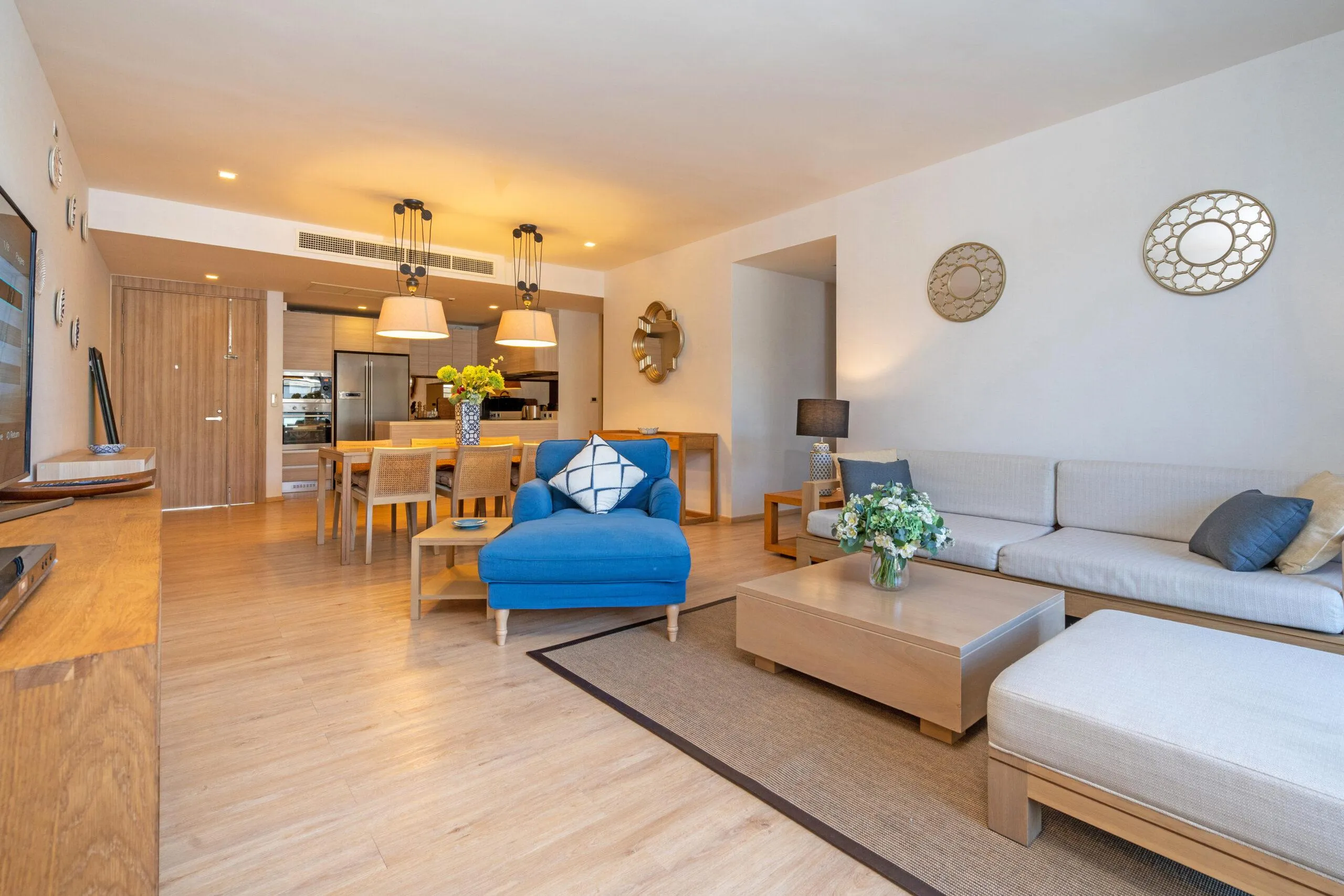 Young Investors reviewing a studio apartment floor plan in Dubai with Burj Khalifa view