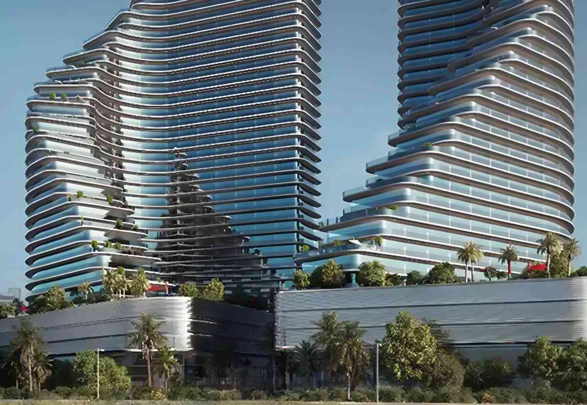 Striking futuristic facade of one of the Binghatti Projects, showcasing unique geometric patterns and flowing lines