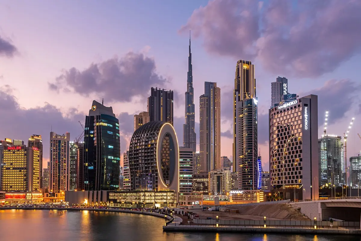 Aerial view of Dubai’s skyline featuring iconic luxury towers and residential districts, highlighting the top areas for high-yield rental income in Dubai.